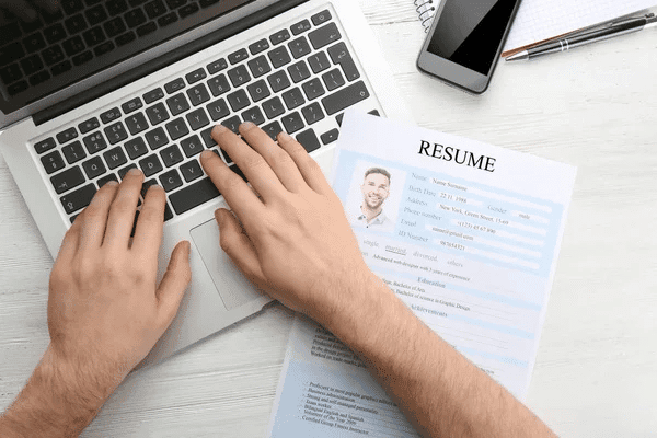 A guide on writing a resume, featuring easy ChatGPT prompts for effective job applications.