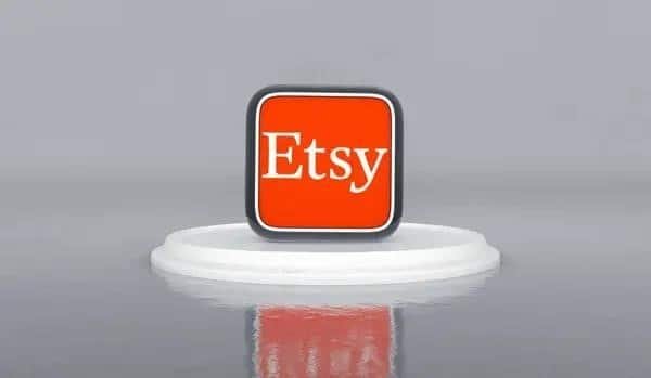 Small red and white sign displaying the word "Etsy," promoting the idea to start an Etsy shop.