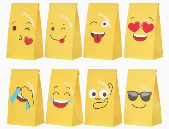 A set of six yellow paper bags featuring various emoticons, designed for DIY goody bags.