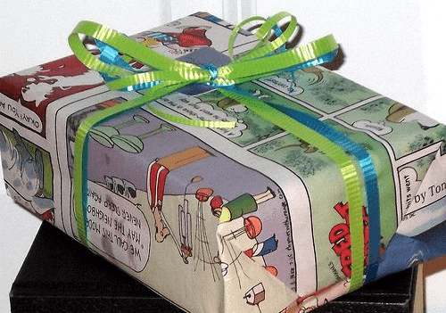 A gift wrapped in a comic book style box, showcasing creative Father's Day gift ideas.