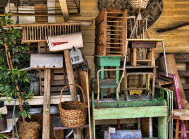 A pile of old furniture and miscellaneous items outside, showcasing potential for farmhouse thrift store makeovers.