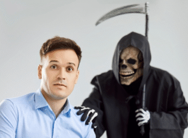 A man sits contemplatively before a grim reaper figure, symbolizing Regrets of the Dying.