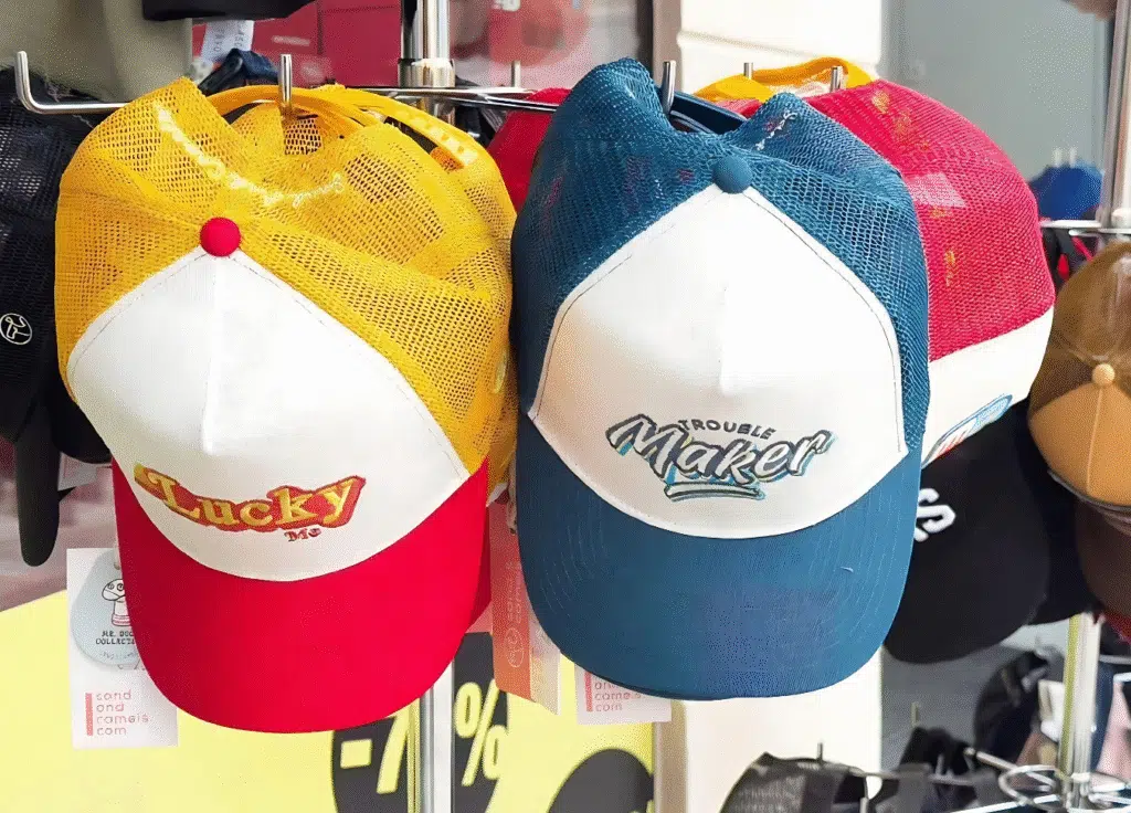 A collection of stylish hats displayed on a rack, labeled "Hats with Hype.