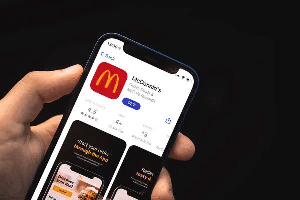 McDonald's app displayed on an iPhone, illustrating how to select the right orders for your meal.