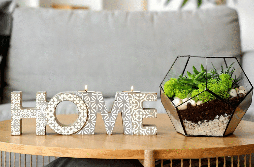 Home decor featuring succulent plants and candles, showcasing a trendy yet overused aesthetic.