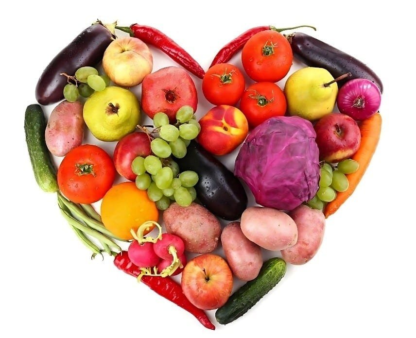 A vibrant heart shape made of assorted fruits and vegetables, promoting fresh produce shopping at the store's edges.