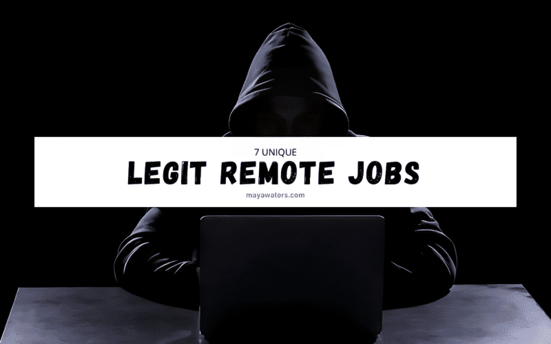 A person wearing a hoodie sitting at a desk with a laptop, surrounded by various items suggesting a work environment. The screen displays the text "7 UNIQUE LEGIT REMOTE JOBS maybewaters.com."