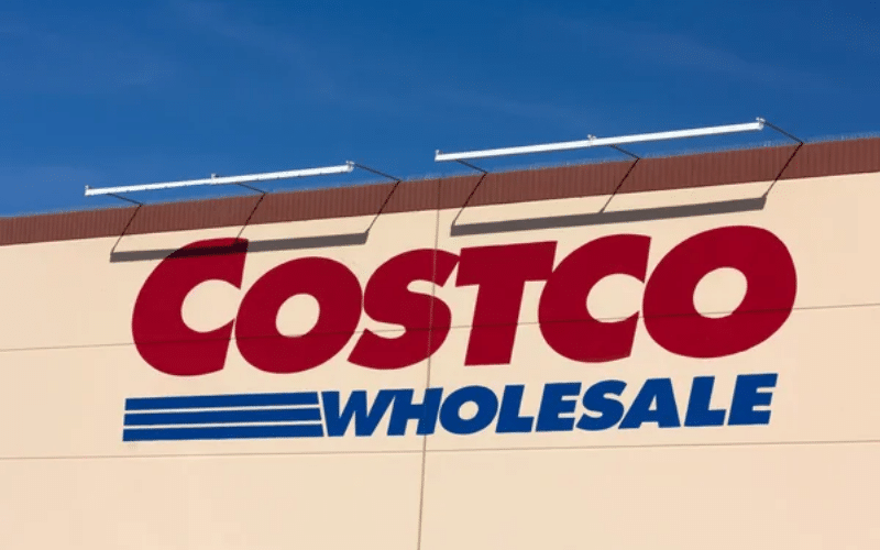 Costco Wholesale sign displayed prominently above a section featuring various freezer meals for sale.