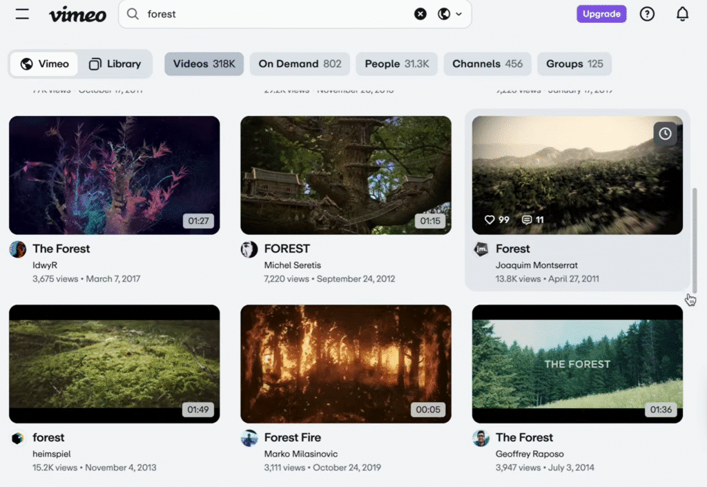 A screenshot of the Vimeo search results page for the keyword “forest,” displaying multiple nature-themed video thumbnails showing forests, moss, and treehouses, along with video titles, view counts, and upload dates.