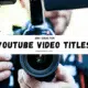 Close-up of a videographer holding a camera with a banner reading “300+ Ideas for YouTube Video Title Ideas,” promoting YouTube video title ideas guide.