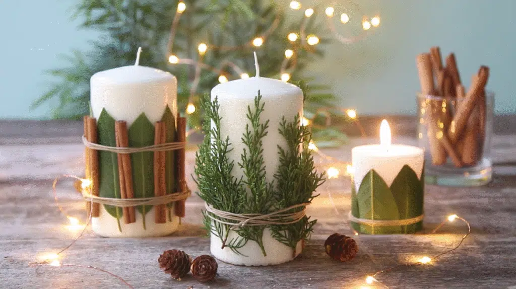 DIY Christmas candles surrounded by pine cones and herbs on a rustic table, creating a festive atmosphere.