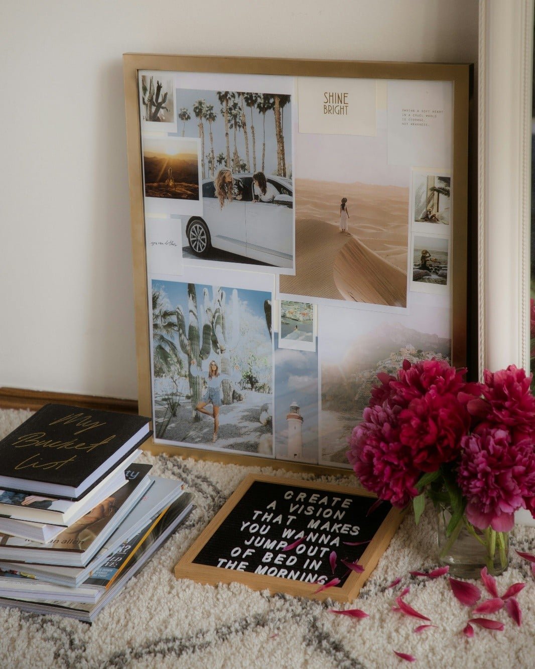 A framed photo of a car surrounded by colorful flowers, displayed on a textured rug.