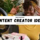 Smiling content creator filming a video with a ring light, representing high-earning Content Creator Ideas for social media platforms.