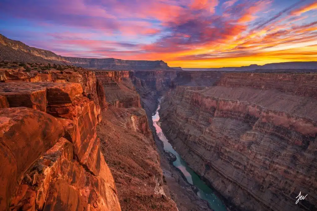 The Grand Canyon at sunset, showcasing vibrant colors over the rock formations in Grand Canyon National Park, Arizona.