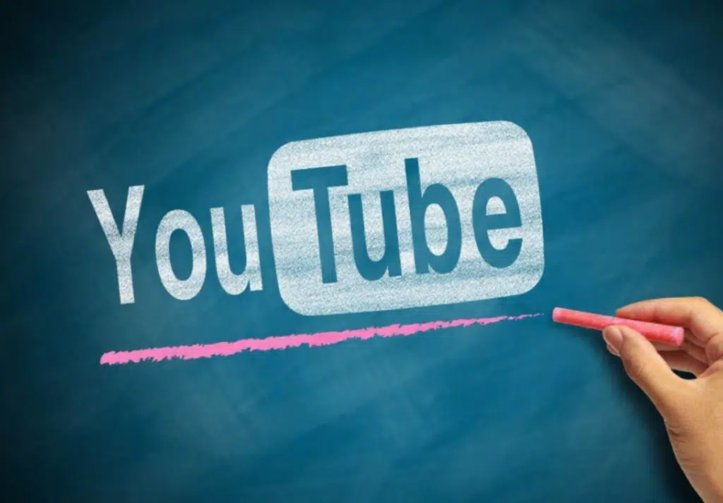 Chalkboard-style illustration of the YouTube logo being drawn with pink chalk, representing YouTube as one of the Good Side Hustles for Women.