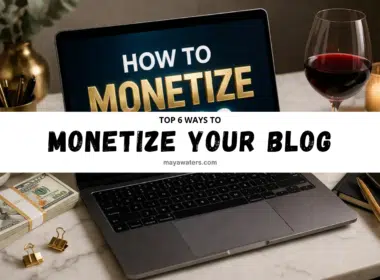 laptop on desk showing how to monetize a blog with money, showcasing behind wine glass, and workspace setup.