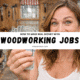 woman holding cash in a woodworking workshop promoting woodworking jobs income.