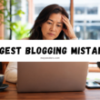 Stressed woman working on a laptop with bold text reading “Biggest Blogging Mistakes.”
