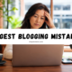 Stressed woman working on a laptop with bold text reading “Biggest Blogging Mistakes.”