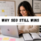 Blogger working at a laptop with a “Why SEO Still Wins” banner for an SEO for bloggers article.