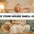 Featured image for “26 Cheap Ways to Make Your House Smell Good,” showing a woman relaxing with her dog in a clean, cozy living room.